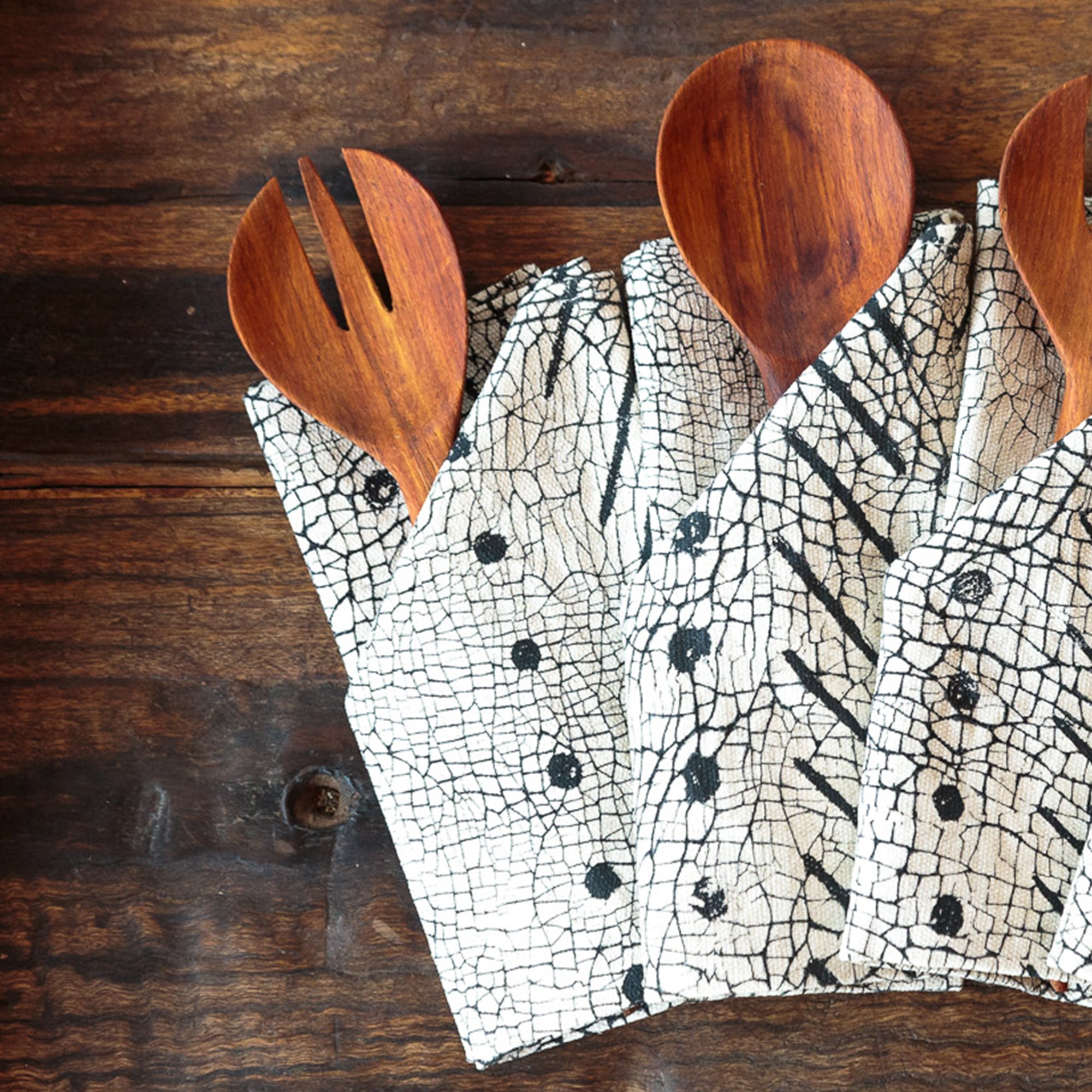 Handmade linen black napkins adorned with geometric patterns, made with 100% cotton for eco-conscious style.