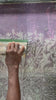 Skilled artisan hand-paints vibrant patterns on cotton fabric in Zambia, creating ethically handcrafted, sustainable textiles for eco-friendly home decor and unique artisan gifts.
