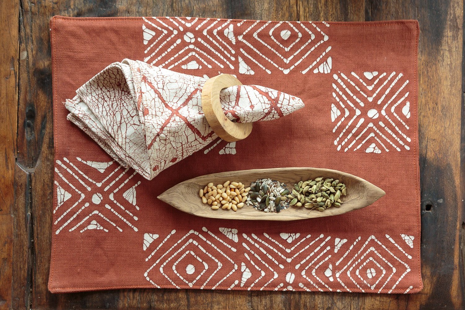 Eco-friendly table mats in Matika Rust red block pattern, perfect for sustainable table settings.