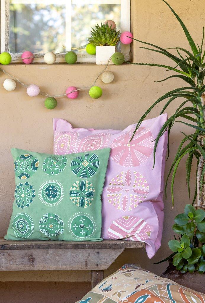 African made, ethical, jade green cushion covers with bright colours and joyous circular patterns