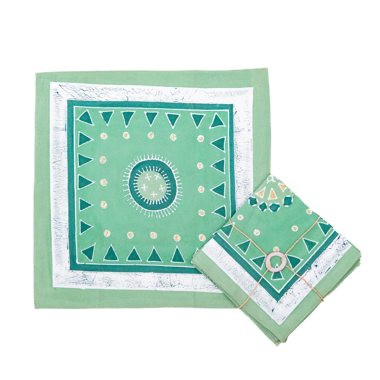 The perfect African-made jade green napkins with gold accents.
