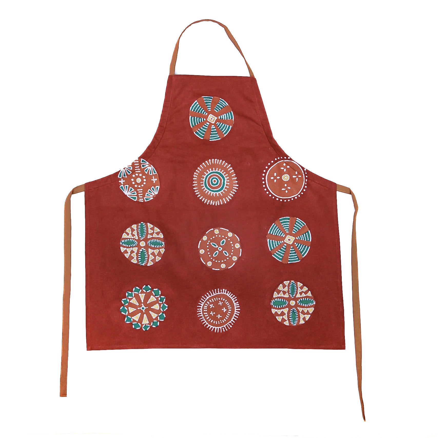 An apron with bright beautiful reds and circular patterns, destined to brighten up any kitchen.