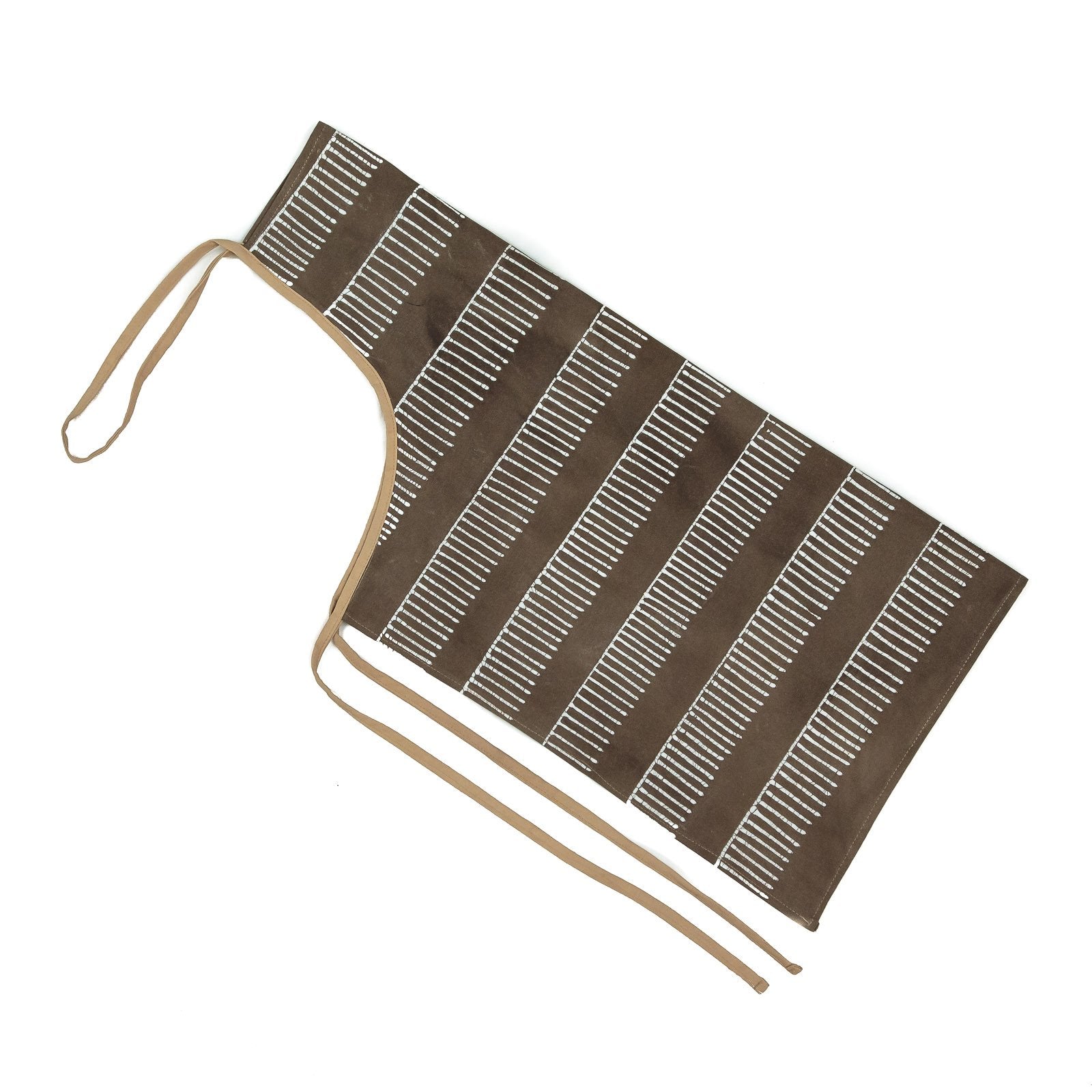 Beige apron with african geometric print.
