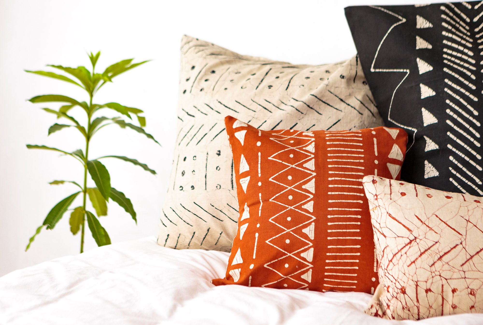 Buy sustainably and ethically made African rust red cushion covers, that look good and do good.