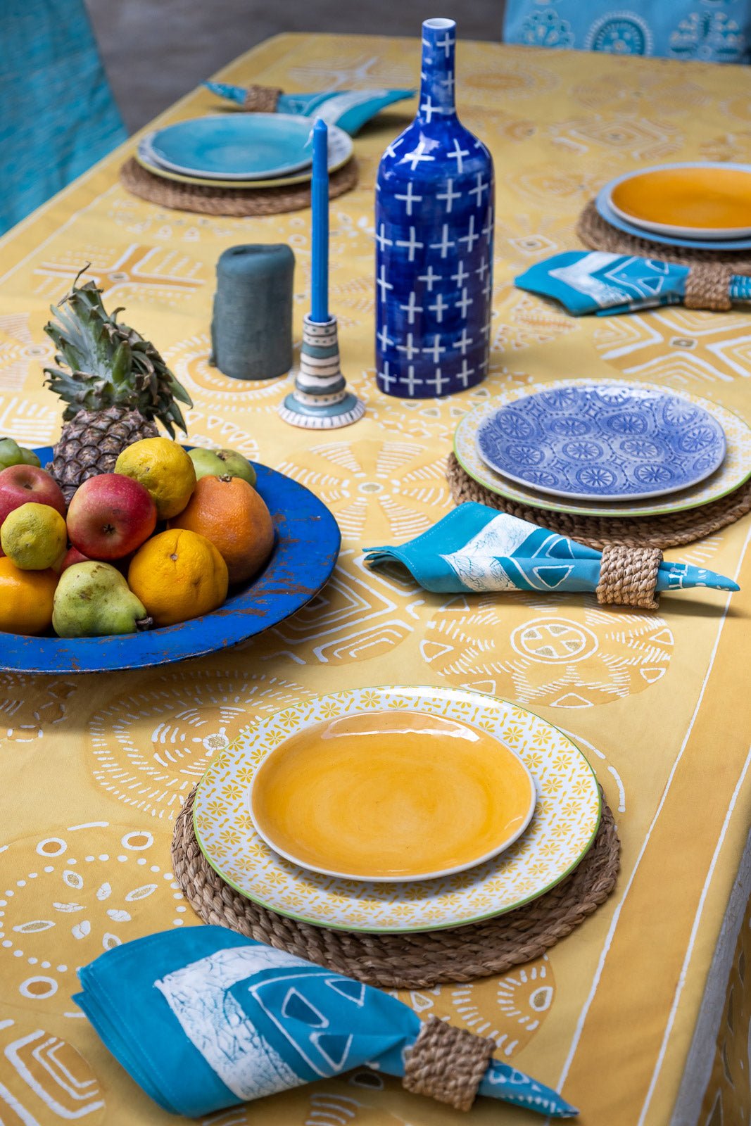 Bright yellow table cloth, with intricate circular patterns and gold accents, made on 100% cotton.
